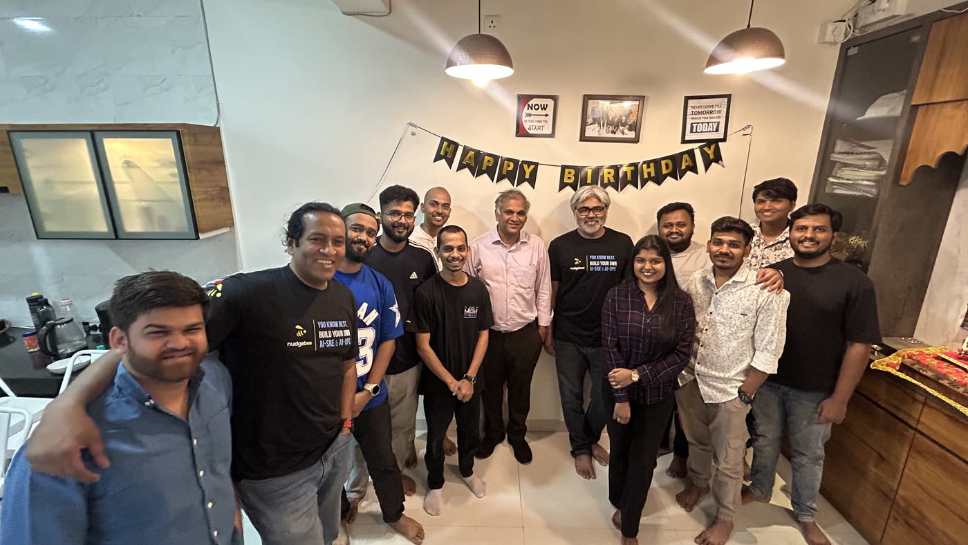 The NudgeBee team celebrating together