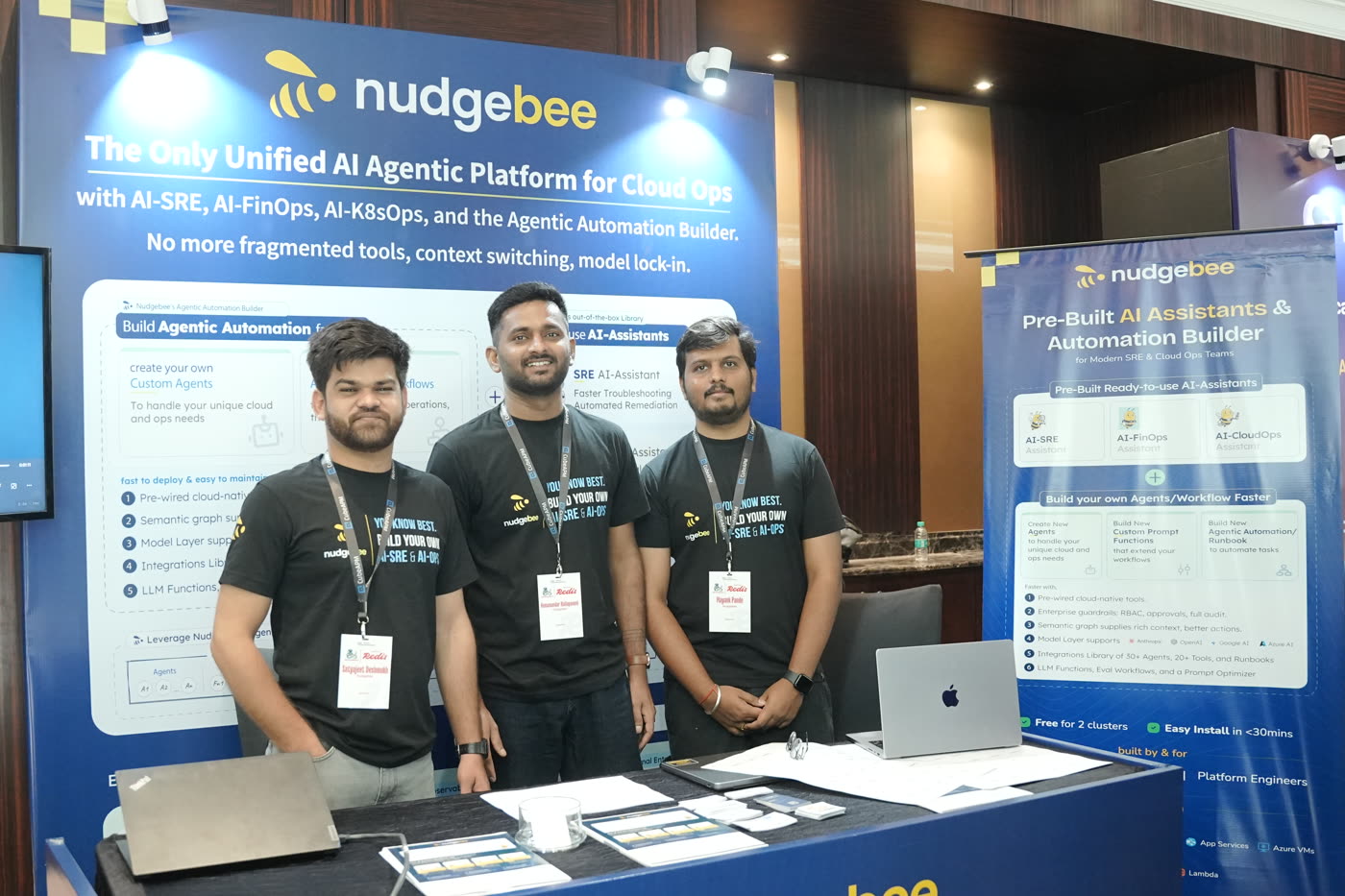 The NudgeBee team at the KubeCon India booth
